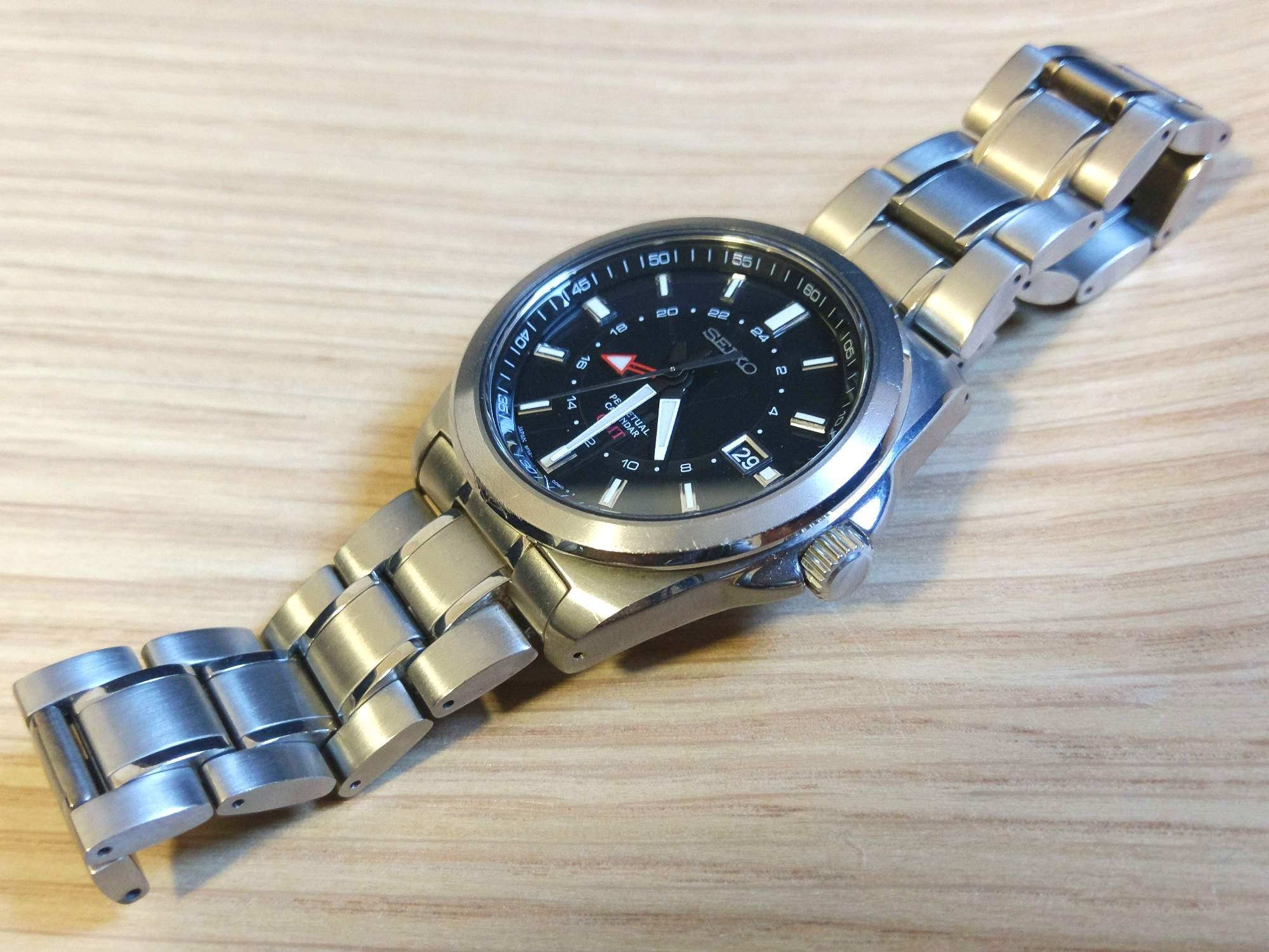 Seiko SBQJ015 (black dial) titanium 8F56 HAQ GMT movement w/ perpetual  movement | WatchUSeek Watch Forums